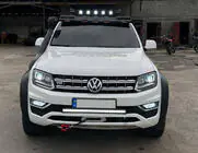 Volkswagen Amarok 2010–2022 Deflektor čelného skla pod strešný nosič DAKAR (LED) fotografia 1